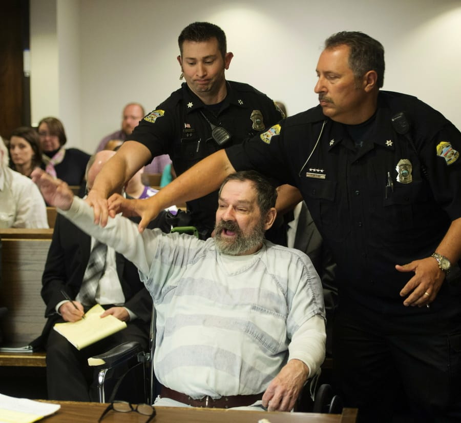 FILE - In this Nov. 10, 2015, file photo, Frazier Glenn Miller Jr., convicted of capital murder, attempted murder and other charges, gestures as Johnson County deputies remove Miller from the courtroom during the sentencing phase of his trial at the Johnson County District Court in Olathe, Kan. A recent Kansas Supreme Court ruling declaring that the state constitution protects access to abortion has opened the door to a new legal attack on the death penalty. Attorneys for five of the 10 men on death row in Kansas, including Miller Jr., argue that the abortion decision means the state’s courts can enforce the broad guarantees of “life, liberty and the pursuit of happiness” in the Bill of Rights in the Kansas Constitution.
