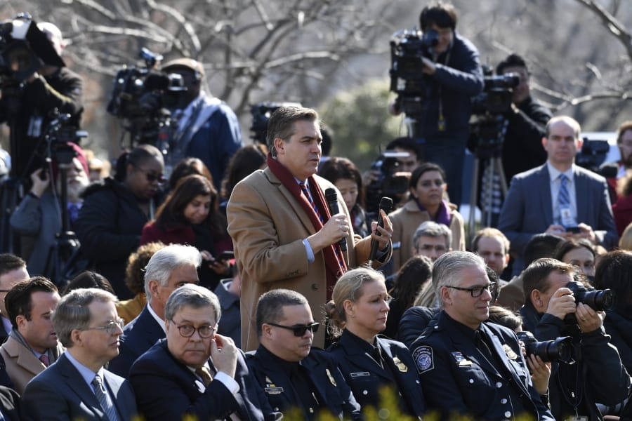 Jim Acosta of CNN asks President Donald Trump a question during an event Feb. 15 in the Rose Garden at the White House in Washington. Acosta is the White House reporter whom Trump’s supporters love to hate. In a new book, he takes aim at the people who criticize the press as “enemy of the people” and his own detractors who say he’s a grandstander.