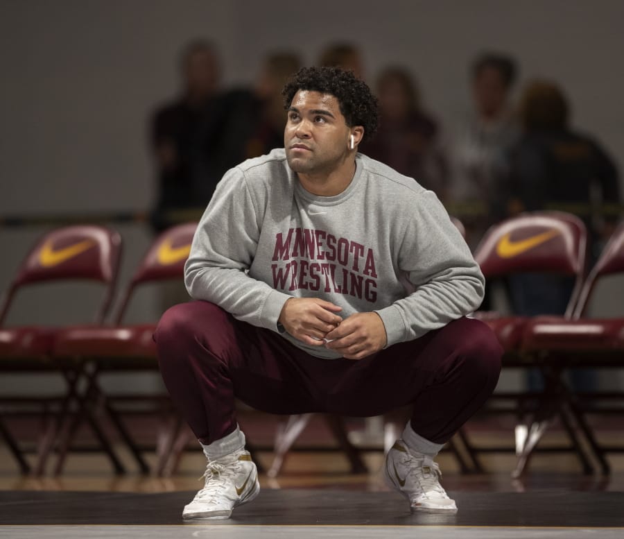 Gable Steveson warms up before wrestling in an NCAA Big Ten tournament in Minneapolis, Minn, Sunday, Jan. 6, 2019. Nationally-ranked University of Minnesota heavyweight wrestler Gable Steveson and a teammate have been arrested on suspicion of criminal sexual conduct. KSTP-TV reports that jail records show Steveson and Dylan Martinez were arrested Saturday night, June 15, 2019, at different times and places in Minneapolis.
