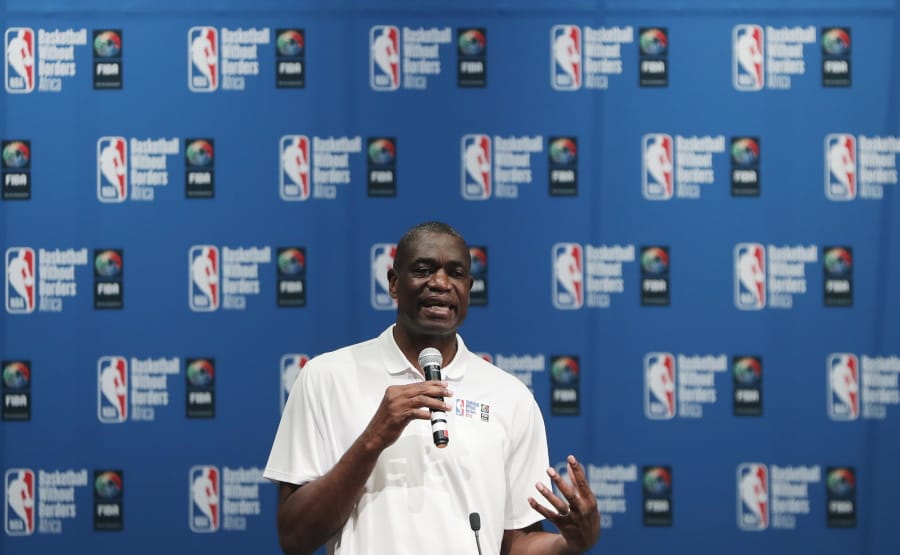 FILE - In this Aug. 1, 2018, file photo, Dikembe Mutombo speaks during the opening ceremony of Basketball without Borders Africa in Johannesburg, South Africa. U.S. health officials are turning to a basketball hall of famer for help in one of the deadliest Ebola outbreaks in history. Dikembe Mutombo is regarded as one of the greatest defensive players in NBA history and is a well-known philanthropist in his native Congo. He recorded radio and video spots designed to persuade people to take precautions and get care that might stop the disease’s spread.