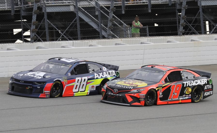 Alex Bowman, left, and Martin Truex Jr., compete during a NASCAR Cup Series auto race at Chicagoland Speedway in Joliet, Ill., Sunday, June 30, 2019. (AP Photo/Nam Y.