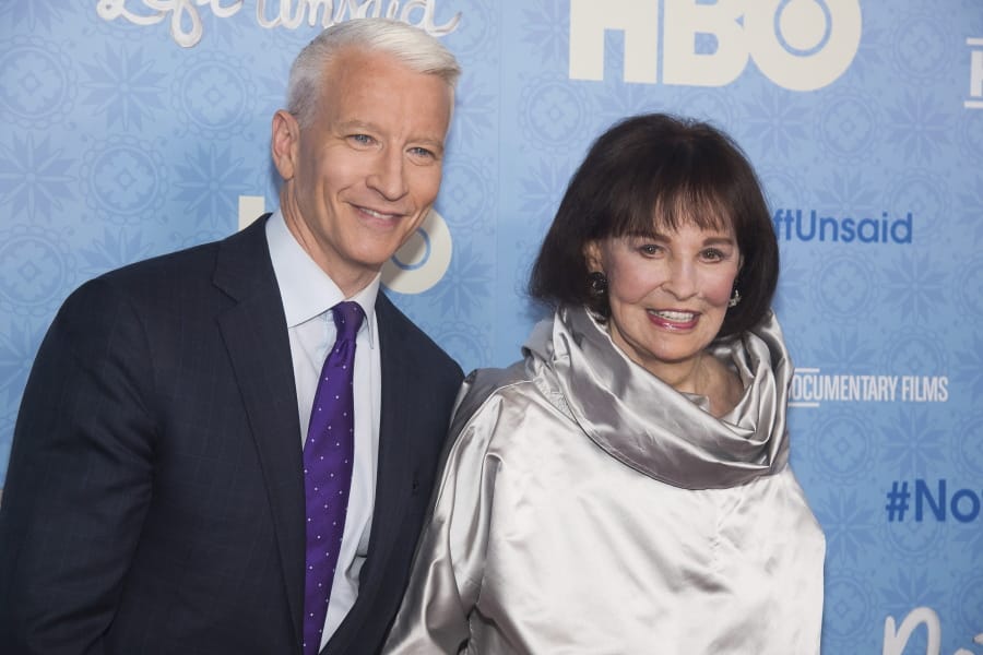FILE - In this April 4, 2016 file photo, CNN anchor Anderson Cooper and Gloria Vanderbilt attend the premiere of “Nothing Left Unsaid” at the Time Warner Center in New York. Vanderbilt, the “poor little rich girl” heiress at the center of a scandalous custody battle of the 1930s and the designer jeans queen of the 1970s and ‘80s, died on Monday, June 17, 2019, at 95, according to her son, Cooper.