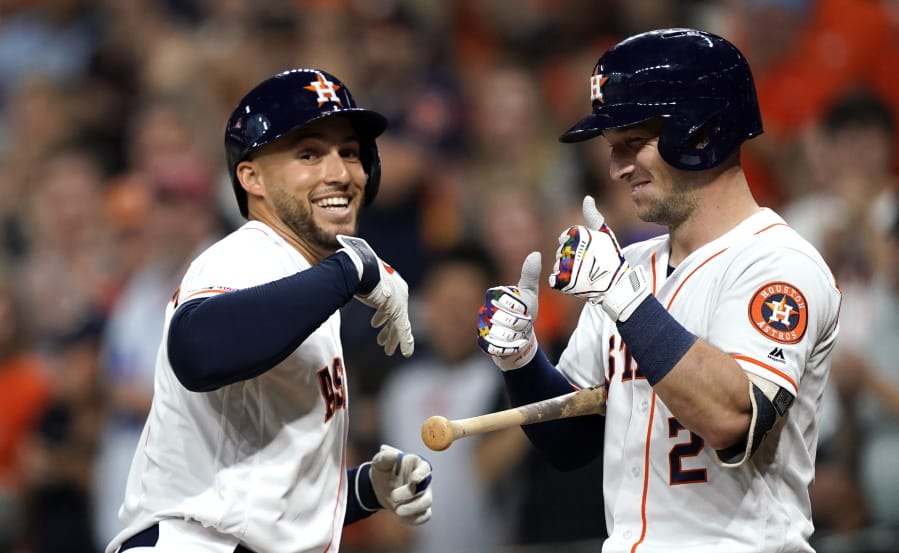 Houston Astros’ George Springer, left, celebrates with Alex Bregman (2) after hitting a home run against the Pittsburgh Pirates during the first inning of a baseball game Wednesday, June 26, 2019, in Houston. (AP Photo/David J.