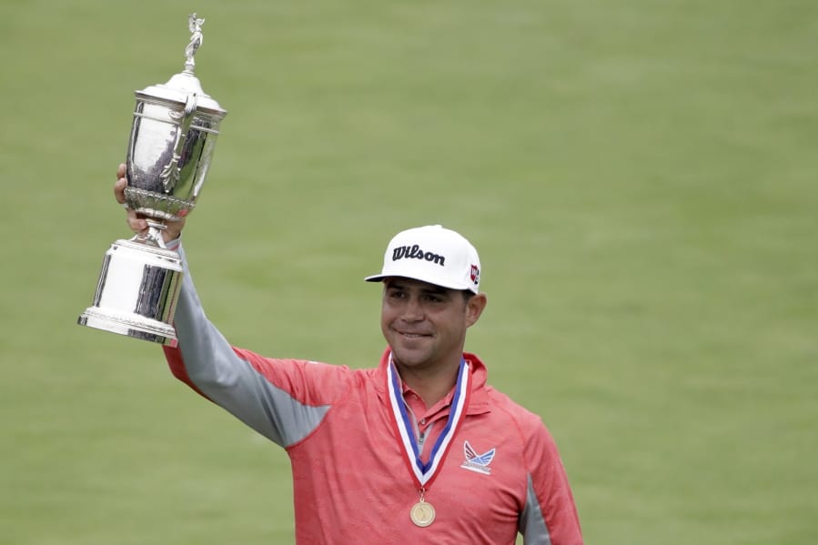 Gary Woodland celebrates with the trophy after winning the U.S. Open Championship golf tournament Sunday, June 16, 2019, in Pebble Beach, Calif.