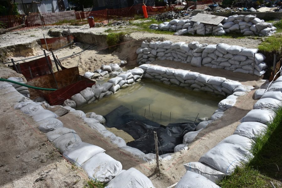 This June 1 photo shows graves of U.S. servicemen under the water table in Tarawa, Kiribati.