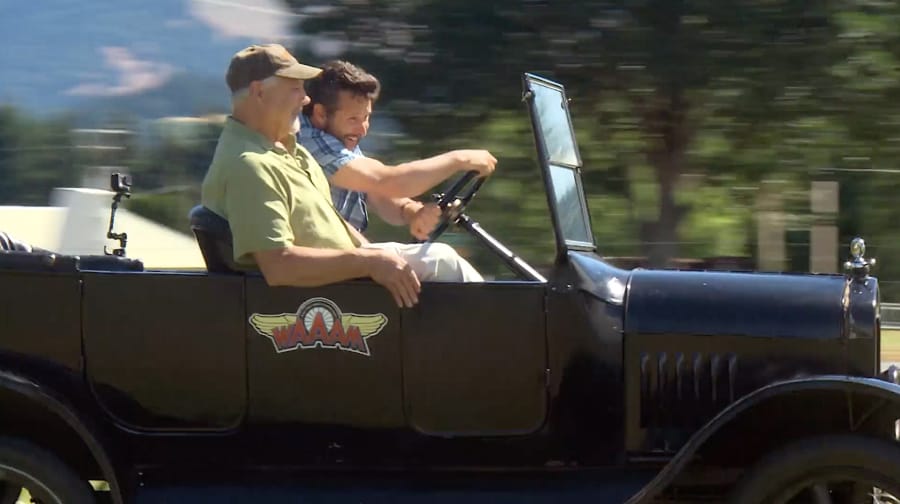 OPB’s Ian McCluskey gets a hands-on experience behind the wheel of a Model T.