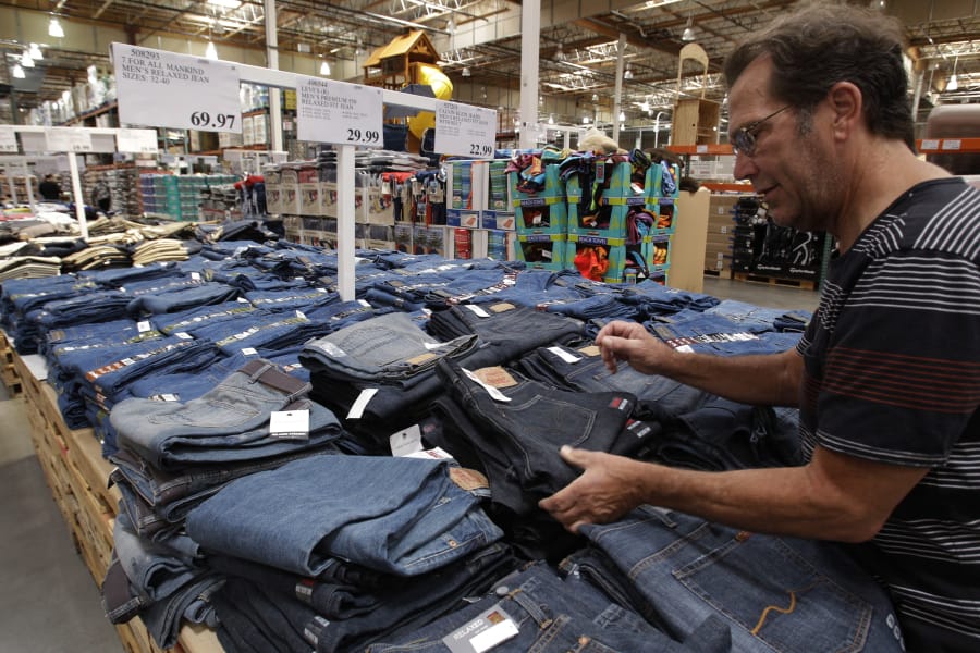A shopper looks at jeans at Costco in Mountain View, Calif.