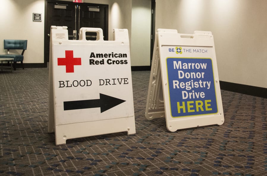 Signs leading to an American Red Cross blood and bone marrow drive are seen at The Nines hotel in Portland in 2017.
