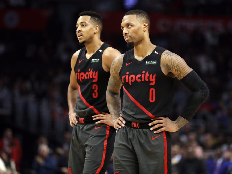CJ McCollum (3) signed a three-year extension Tuesday that will keep him teamed up in the Blazers’ backcourt for five more season with Damian Lillard (0).