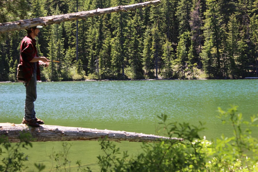 Jeff Otto of Sandy, Ore., casts a spinner to trout in a high-elevation Cascades Mountains lake. The WDFW stocks hundreds of mountain lakes, and many of the best ones are in the Indian Heaven Wilderness.