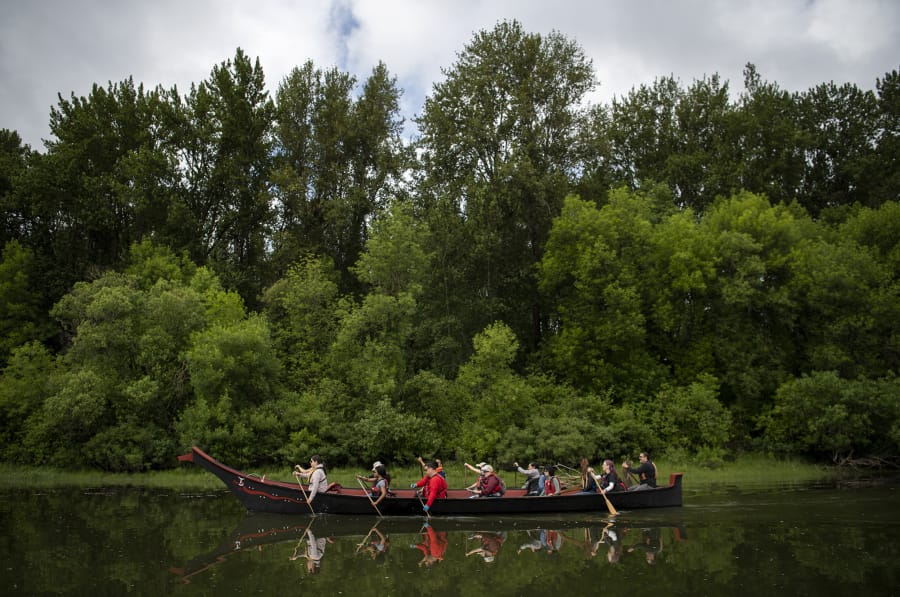Students from Washington State University Vancouver’s Native American literature course and local tribal leaders conduct their class from a 15-person tribal canoe.