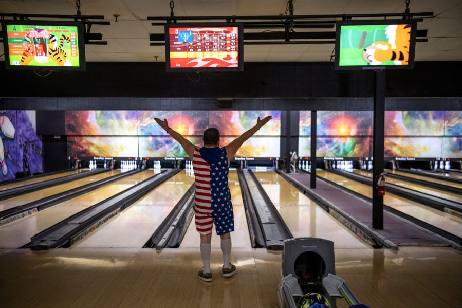 Clinton Cotton of Vancouver celebrates a successful bowl at Allen’s Crosley Lanes. The Vancouver Parks and Recreation department currently offers two bowling sessions a week for people with disabilities but is capping the number of participants allowed at each session.