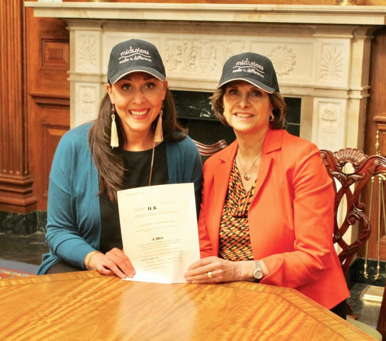 Rep. Jaime Herrera Beutler, left, with Rep. Lucille Roybal-Allard, D-Calif., and a copy of the Midwives for Maximizing Optimal Maternity Services Act.
