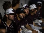 The Raptors watch the game from the dugout during Tuesday nightÕs game against the Bells at the Ridgefield Outdoor Recreation Complex on July 30, 2019.