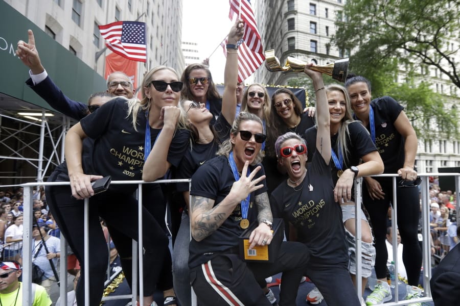 Megan Rapinoe holds the Women’s World Cup trophy as the U.S. women’s soccer team is celebrated with a parade along the Canyon of Heroes, Wednesday, July 10, 2019, in New York. The U.S. national team beat the Netherlands 2-0 to capture a record fourth Women’s World Cup title. Wednesday, July 10, 2019.