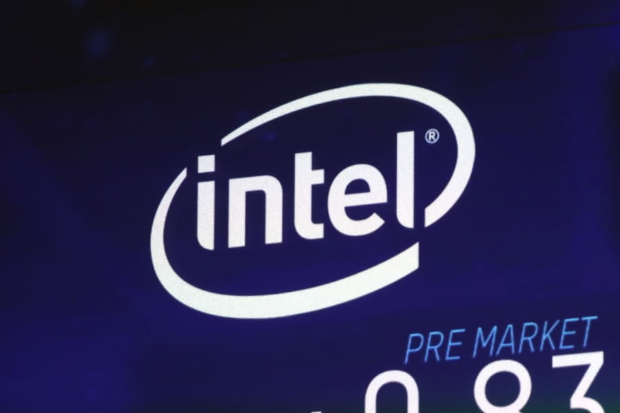 FILE - In this Oct. 3, 2018, file photo the Intel logo appears on a screen at the Nasdaq MarketSite, in New York’s Times Square. Apple is paying Intel $1 billion for the chip maker’s smartphone modem division in a deal driven by the upcoming transition to the next generation of wireless technology.