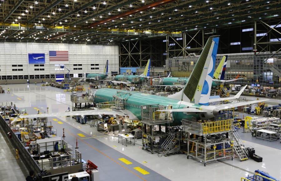 FILE - This Dec. 7, 2015, file photo shows the second Boeing 737 MAX airplane being built on the assembly line in Renton, Wash. American Airlines says it will keep the Boeing 737 Max plane off its schedule until Nov. 3, 2019, which is two months longer than it had planned. In a statement Sunday, July 14, American says the action will result in the cancellation of about 115 flights per day. (AP Photo/Ted S.
