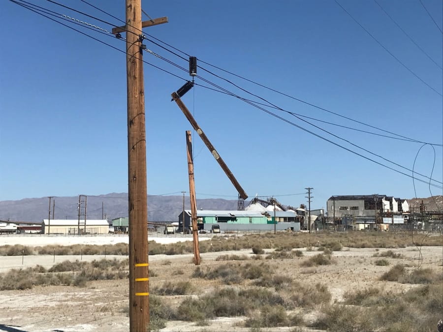 Utility poles are damaged from an earthquake, Thursday, July 4, 2019, in Trona, Calif. A strong earthquake rattled a large swath of Southern California and parts of Nevada on Thursday, rattling nerves on the July 4th holiday and causing some damage in a town near the epicenter, followed by a swarm of aftershocks.