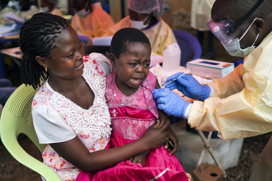 In this photograph taken Saturday July 13, 2019, A girl receives the Ebola vaccine in Beni, Congo DRC. The head of the World Health Organization is convening a meeting of experts Wednesday July 17, 2019 to decide whether the Ebola outbreak should be declared an international emergency after spreading to eastern Congo’s biggest city, Goma, this week. More than 1,600 people in eastern Congo have died as the virus has spread in areas too dangerous for health teams to access.