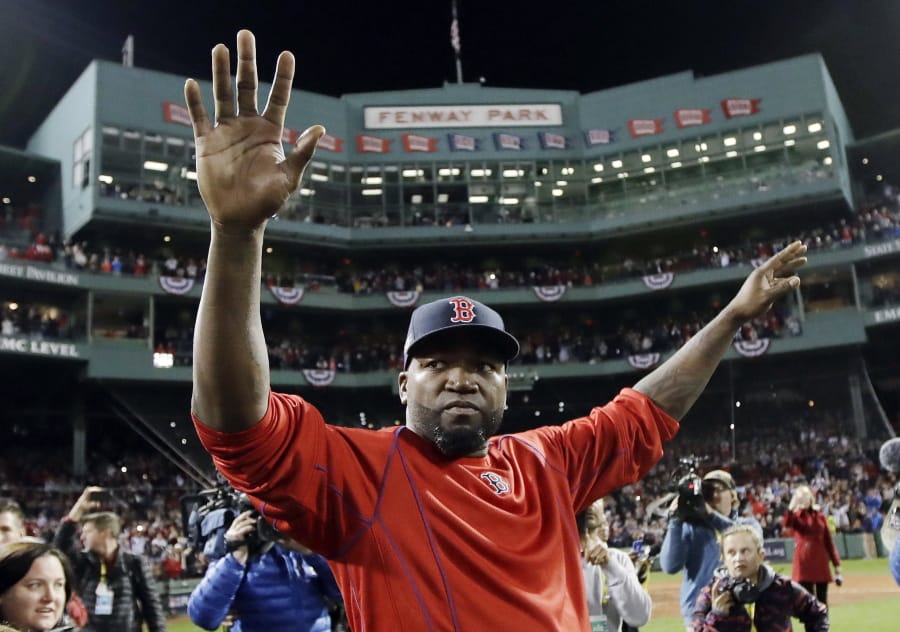David Ortiz waves from the field at Fenway Park on Oct. 10, 2016. The former Red Sox slugger is out of the hospital following three surgeries after being shot in the back at a bar in the Dominican Republic.