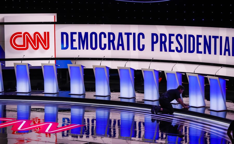 Workers get the stage ready for the Democratic primary debate hosted by CNN Tuesday, July 30, 2019, at the Fox Theatre in Detroit.