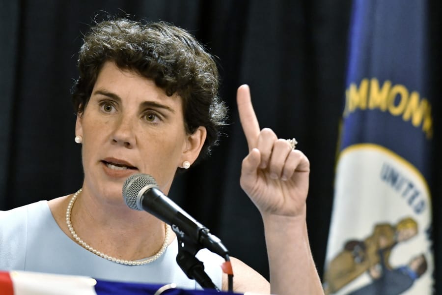 FILE - In this Aug. 18, 2018 file photo, Amy McGrath speaks to supporters during the 26th Annual Wendell Ford Dinner in Louisville, Ky. McGrath, a Marine combat aviator who narrowly lost a House race to an incumbent Republican in Kentucky, has set her sights on an even more formidable target: Senate Majority Leader Mitch McConnell. (AP Photo/Timothy D.