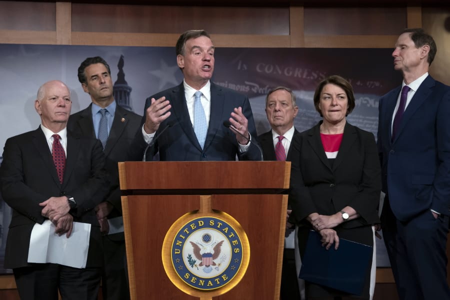 Sen. Mark Warner, D-Va., vice-chair of the Senate Intelligence Committee, is joined by fellow Democrats as he tells reporters that the Republicans have killed every piece of legislation the Democrats have crafted to protect elections, during a news conference at the Capitol in Washington, Tuesday, July 23, 2019. Warner is joined by, from left, Sen. Ben Cardin, D-Md., Rep. John Sarbanes, D-Md., Sen. Dick Durbin, D-Ill., Sen. Amy Klobuchar, D-Minn., and Sen. Ron Wyden, D-Ore. (AP Photo/J.