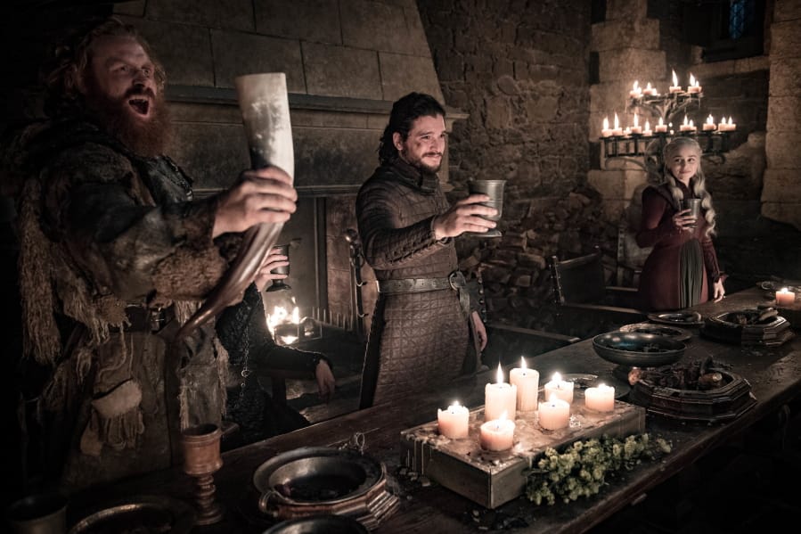 This image released by HBO shows Kristofer Hivju, from left, Kit Harington and Emilia Clarke in a scene from “Game of Thrones.” “Game of Thrones,” “Veep” and “The Big Bang Theory,” three major series that wrapped last season, will find out with Tuesday’s nominations if they have one more chance at Emmy gold.