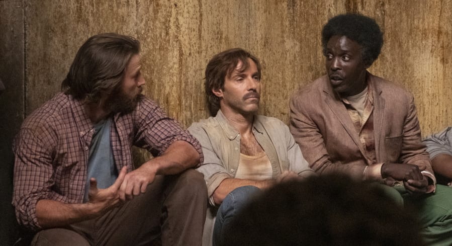 This image released by Netflix shows Chris Evans, from left, Alessandro Nivola and Michael Kenneth Williams in a scene from “The Red Sea Diving Resort.” (Marcos Cruz/Netflix via AP)