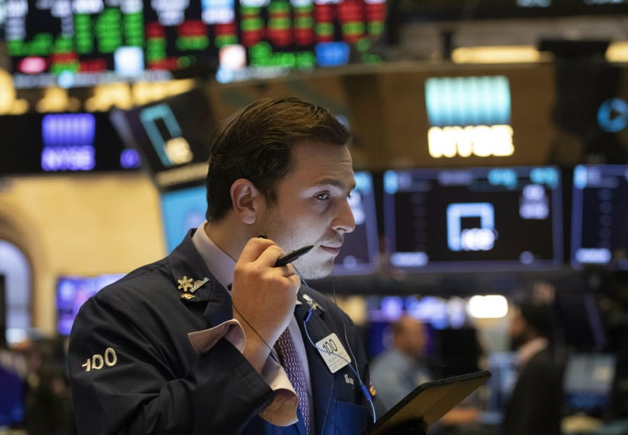FILE - In this July 5, 2019, file photo trader Benjamin Tuchman works at the New York Stock Exchange in New York. The U.S. stock market opens at 9:30 a.m. EDT on Thursday, July 11.