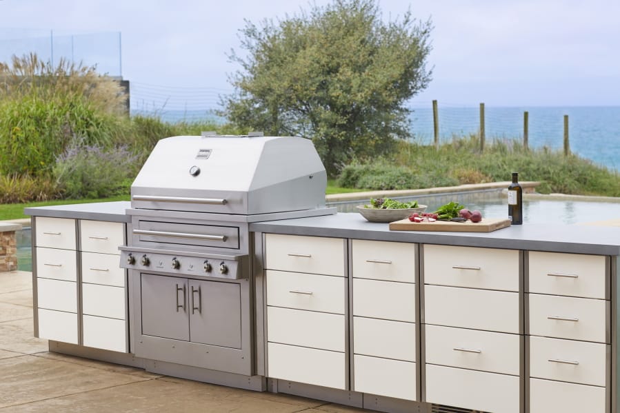 Kalamazoo Outdoor Gourmet’s Hybrid professional grill and Arcadia series cabinetry is shown at a home in Grand Beach, Mich. Adding built-in cooking and storage space around a grill increases the value of a home.