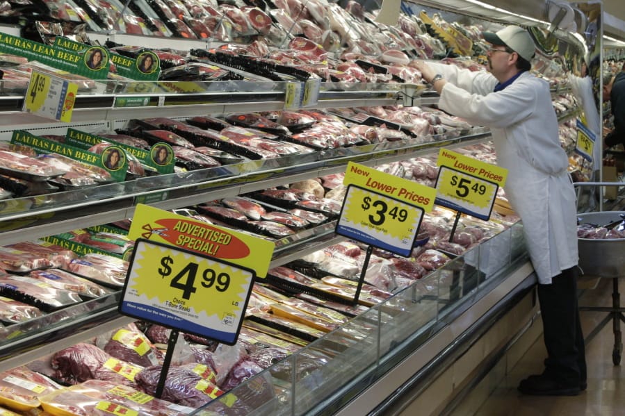 A worker stocks the fresh meat shelves March 1, 2011 at a Kroger Co. supermarket in Cincinnati. The supermarket is one of the most important places to be shopping-savvy. The good news is that there are so many easy and effective way to slash your grocery budget.