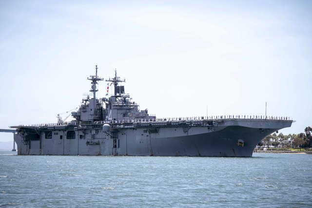 In this May 1, 2019, photo provided by the U.S. Navy, the amphibious assault ship USS Boxer (LHD 4) transits the San Diego Bay in San Diego, Calif. President Donald Trump says the USS Boxer destroyed an Iranian drone in the Strait of Hormuz amid heightened tensions between the two countries. Trump says it's the latest "hostile" action by Iran. (Mass Communication Specialist 2nd Class Jesse Monford/U.S.