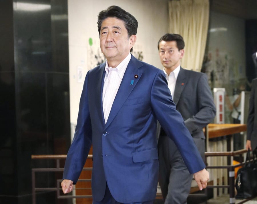 Japan’s Prime Minister Shinzo Abe enters the headquarters of his Liberal Democratic Party in Tokyo, Sunday, July 21, 2019.