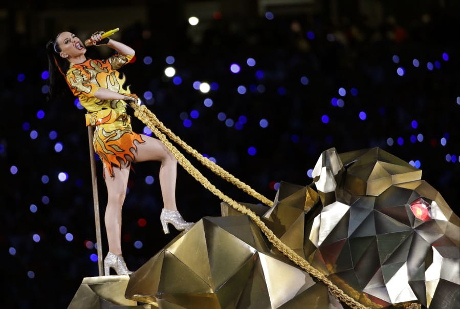 FILE - In this Sunday, Feb. 1, 2015 file photo, singer Katy Perry performs during halftime of NFL Super Bowl XLIX football game between the Seattle Seahawks and the New England Patriots in Glendale, Ariz. The penalty phase in a copyright infringement trial will begin Tuesday, July 30, 2019, in Los Angeles and will determine how much Perry and other creators of her hit song “Dark Horse” will owe for improperly copying elements of a 2009 Christian rap song. (AP Photo/David J.
