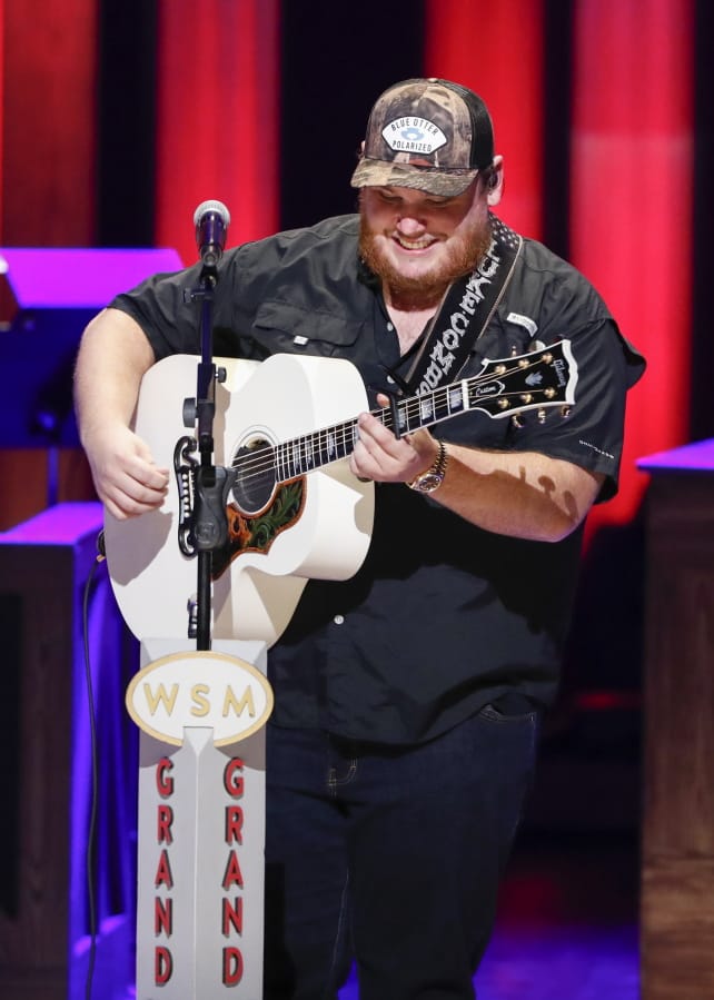 Luke Combs performs at “Luke Combs Joins the Grand Ole Opry Family,” at Grand Ole Opry, Tuesday, July 16, 2019, in Nashville, Tenn.