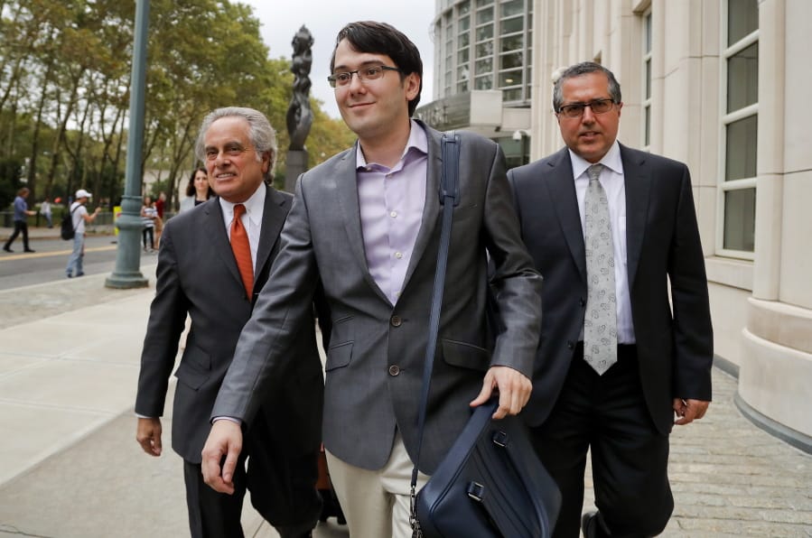 FILE - In this Thursday, July 27, 2017, file photo, Martin Shkreli, center, leaves federal court with his attorney Benjamin Brafman, left, in New York. A federal appeals court on Thursday, July 18, 2019 has upheld the securities fraud conviction against the former drug company CEO.