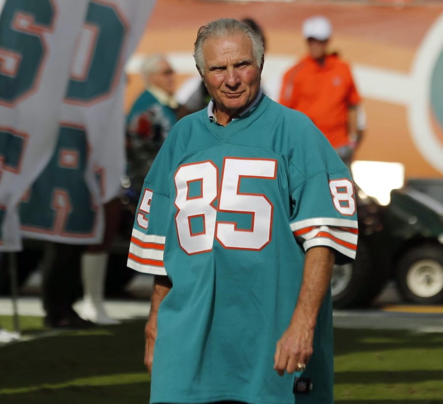 FILE - In this Dec. 16, 2012, file photo, Nick Buoniconti, former Miami Dolphins player and member of the 1972 undefeated team, in introduced during the half time show of an NFL football game against the Jacksonville Jaguars, in Miami. Pro Football Hall of Fame middle linebacker Nick Buoniconti, an undersized overachiever who helped lead the Miami Dolphins to the NFL’s only perfect season, has died at the age of 78. Bruce Bobbins, a spokesman for the Buoniconti family, said he died Tuesday, July 30, 2019, in Bridgehampton, N.Y.