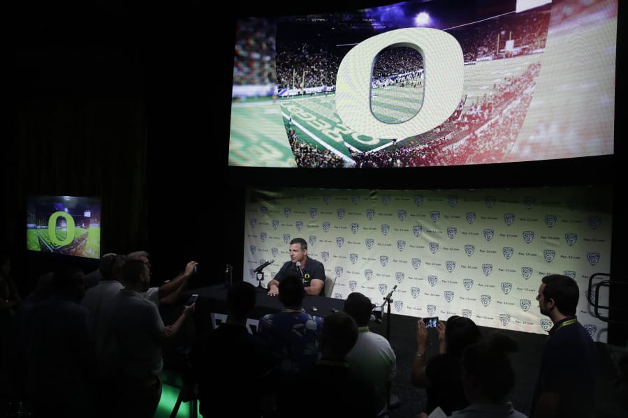 Oregon head coach Mario Cristobal answers questions during the Pac-12 Conference NCAA college football Media Day Wednesday, July 24, 2019, in Los Angeles.