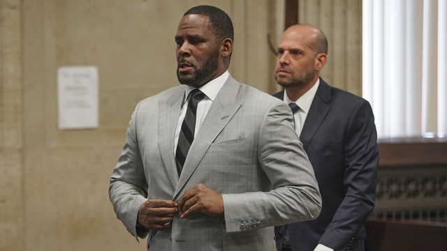 In this June 6, 2019, file photo, singer R. Kelly pleaded not guilty to 11 additional sex-related felonies during a court hearing before Judge Lawrence Flood at Leighton Criminal Court Building in Chicago. R. Kelly, already facing sexual abuse charges brought by Illinois prosecutors, was arrested in Chicago Thursday, July 11, 2019 on a federal grand jury indictment listing 13 counts including sex crimes and obstruction of justice. (E.