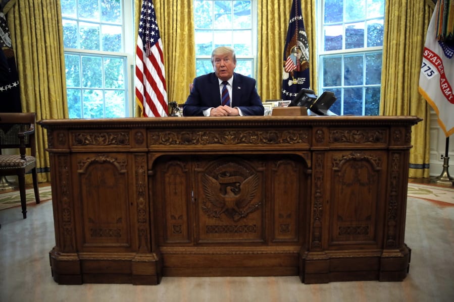 President Donald Trump speaks to the media in the Oval Office of the White House in Washington, Friday, July 26, 2019.