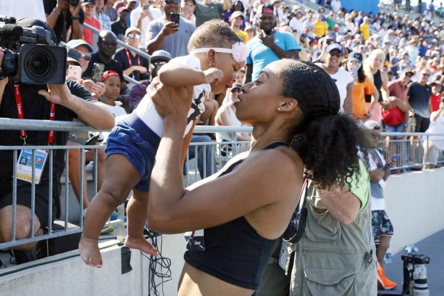 Allyson Felix holds her daughter Camryn after running the women’s 400-meter dash final at the U.S. Championships athletics meet, Saturday, July 27, 2019, in Des Moines, Iowa.