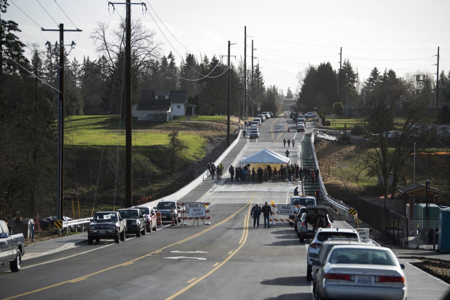 Local officials and community members commemorate the opening of the bridge on Northeast 10th Avenue over Whipple Creek south of the fairgrounds in Vancouver on Dec. 18, 2018.