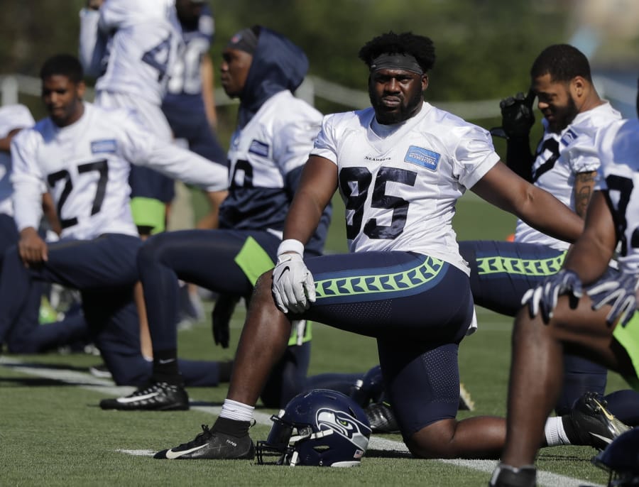 Seahawks defensive end L.J. Collier has been on the practice field since hurting his ankle in late July. Ted S.