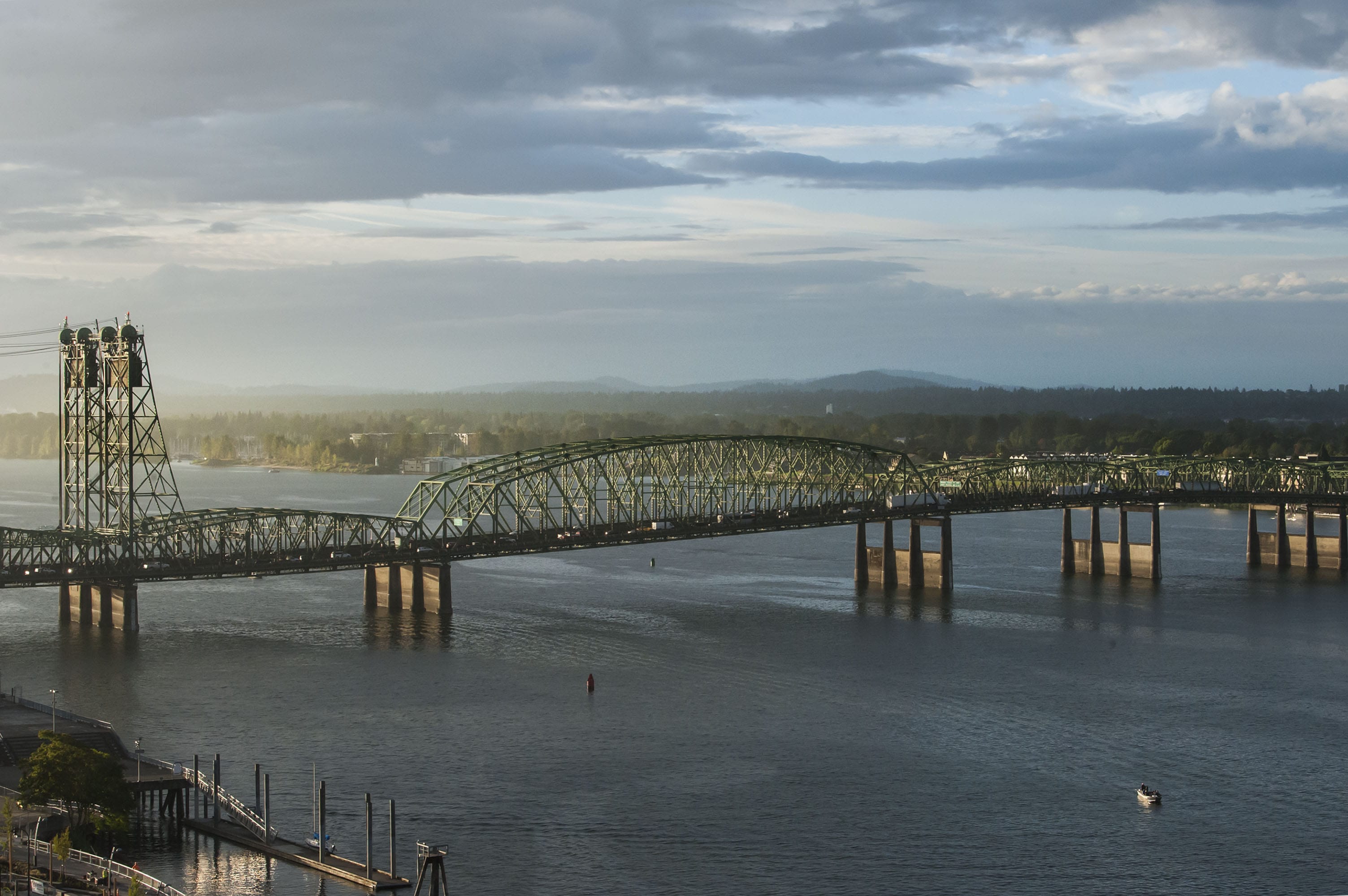 The I-5 Bridge stretches over the Columbia River during a sunrise in September.