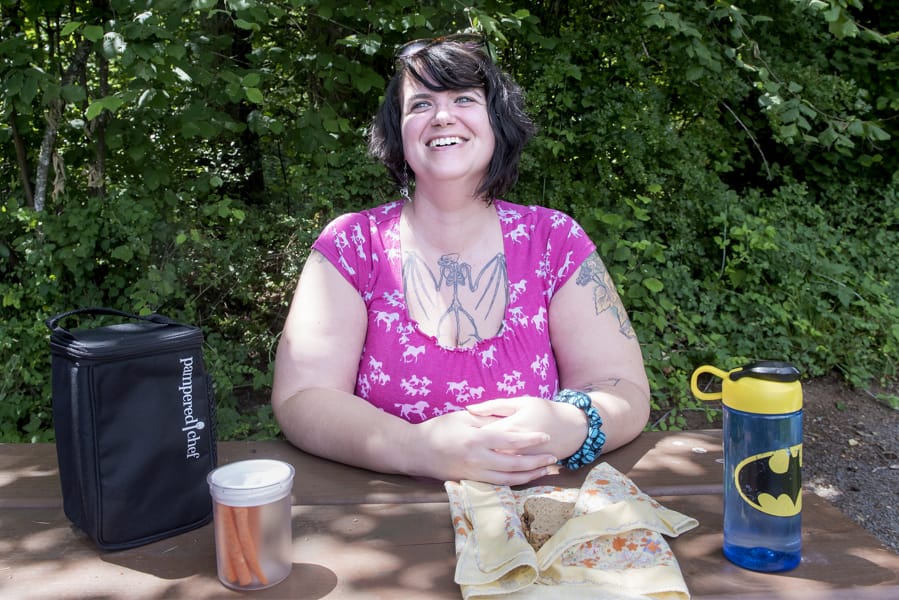 Heather Fisher of Vancouver strives to reduce garbage. She packed her lunch in reusable containers for a picnic at Hockinson Meadows Community Park, but wishes she could take her own containers to fill at the grocery store, a practice currently prohibited by Washington health codes. Proposed revisions would change that.