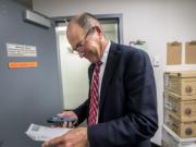 Clark County Auditor Greg Kimsey views the first primary election result printout in the Ballot Tabulation Room of the Clark County Election Office on Tuesday night, Aug. 6, 2019.