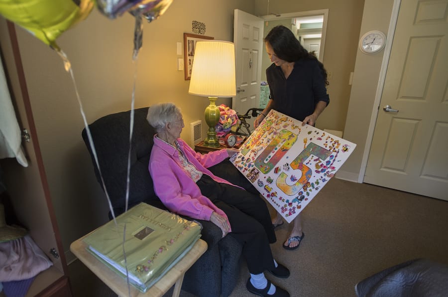 Murillian “Mimi” Allen of Vancouver celebrates her 105th birthday with her granddaughter-in-law, Tammie Gower of Washougal, at Brookdale Vancouver Stonebridge on Monday afternoon.