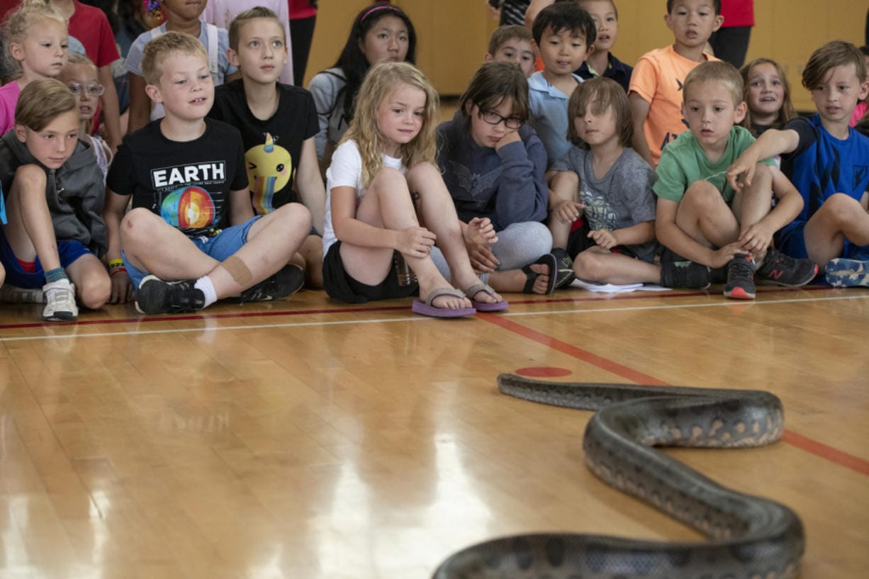 A crowd of children are entertained Friday by a king cobra named Hannah during a demonstration by Steve Lattanzi of Steve’s Creature Feature at the Jack, Will and Rob Center. The Camas School District took over the center about a year ago after the Boys & Girls Clubs of Portland ran operations at the center for the previous 14 years. Above, the center is seen from outside.