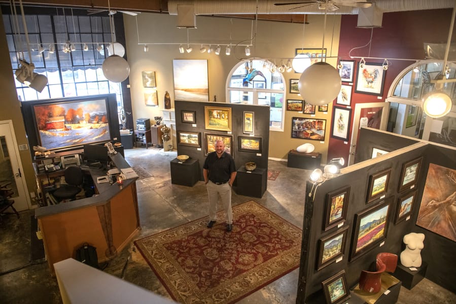 Kevin Weaver is surrounded by artwork at his gallery, Art On The Boulevard. “I always joke with people that I have the best office in town,” said Weaver, who was recently named to the city’s revived Arts, Culture and Heritage Commission.